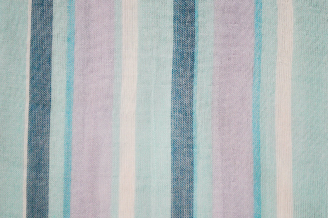 Striped fabric with blue, purple, and white horizontal stripes on a light blue background