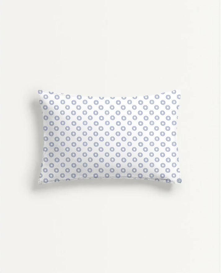 Rectangular pillow with a blue and white pattern on a light gray background