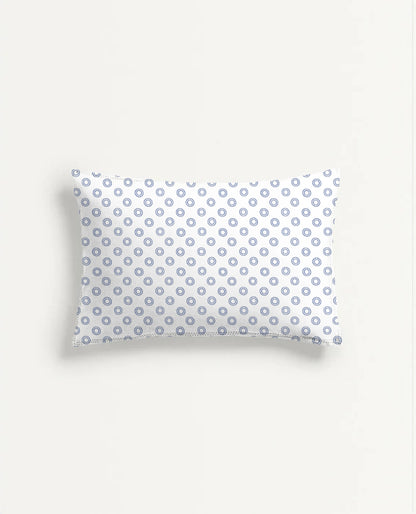 Rectangular pillow with a blue and white pattern on a light gray background