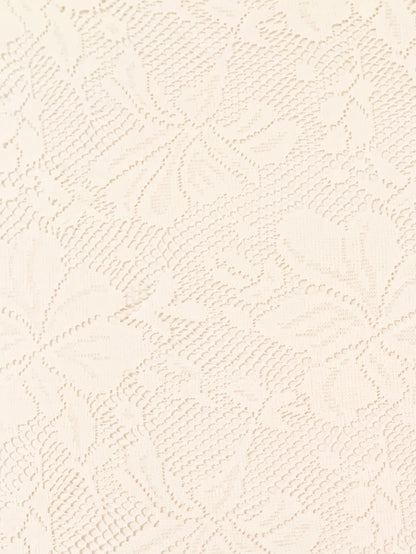 Close-up of a textured beige fabric with a subtle pattern