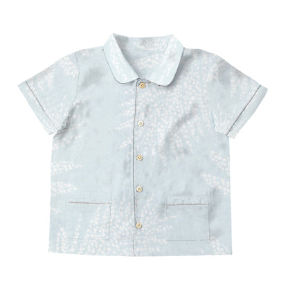 Light blue shirt with white floral pattern on a white background