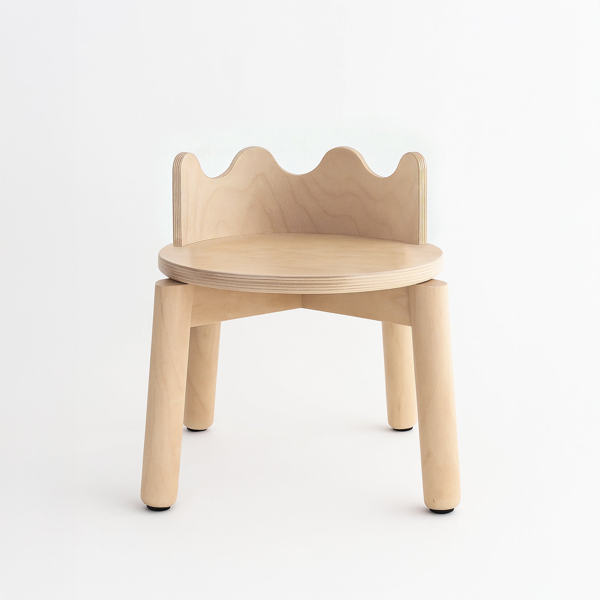 Wooden children's chair with a scalloped backrest on a white background