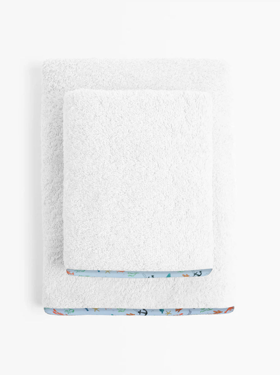 White towel with a colorful  sea garden  border on a white background