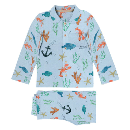 Children's shirt with ocean-themed print on a white background