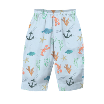 Children's shorts with nautical pattern on a light blue background