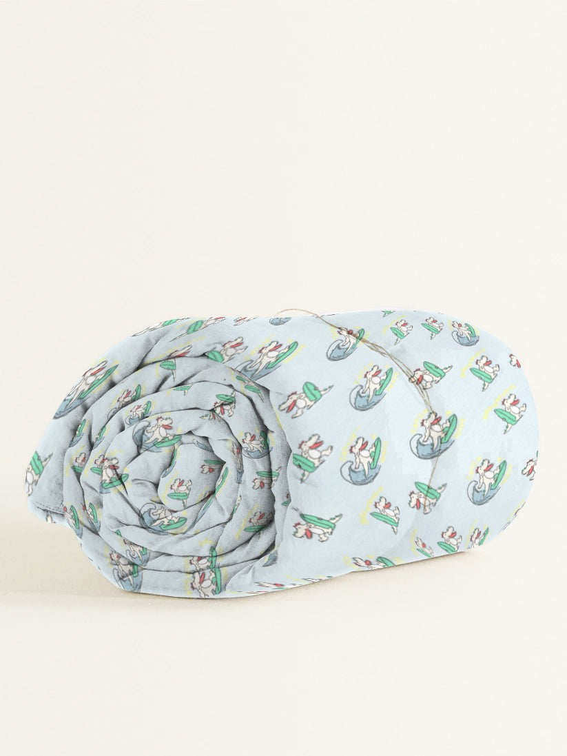 Rolled-up fabric with a pattern of cartoon characters on a light blue background