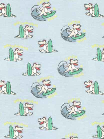 Pattern of cartoon dogs surfing on a light blue background