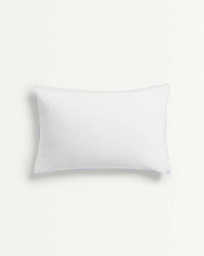 White pillow on a light gray background