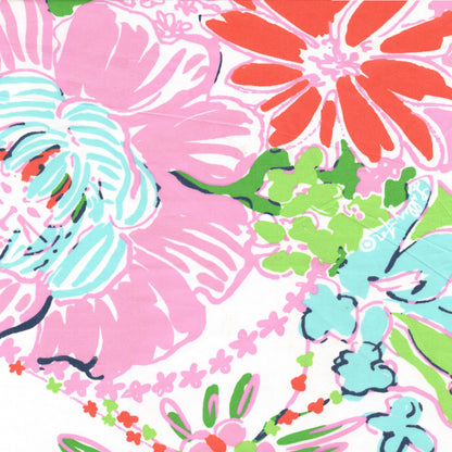 Colorful floral pattern with pink, orange, green, and blue flowers on a white background.