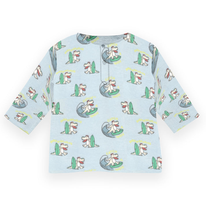 Light blue shirt with cartoon dog pattern on a white background