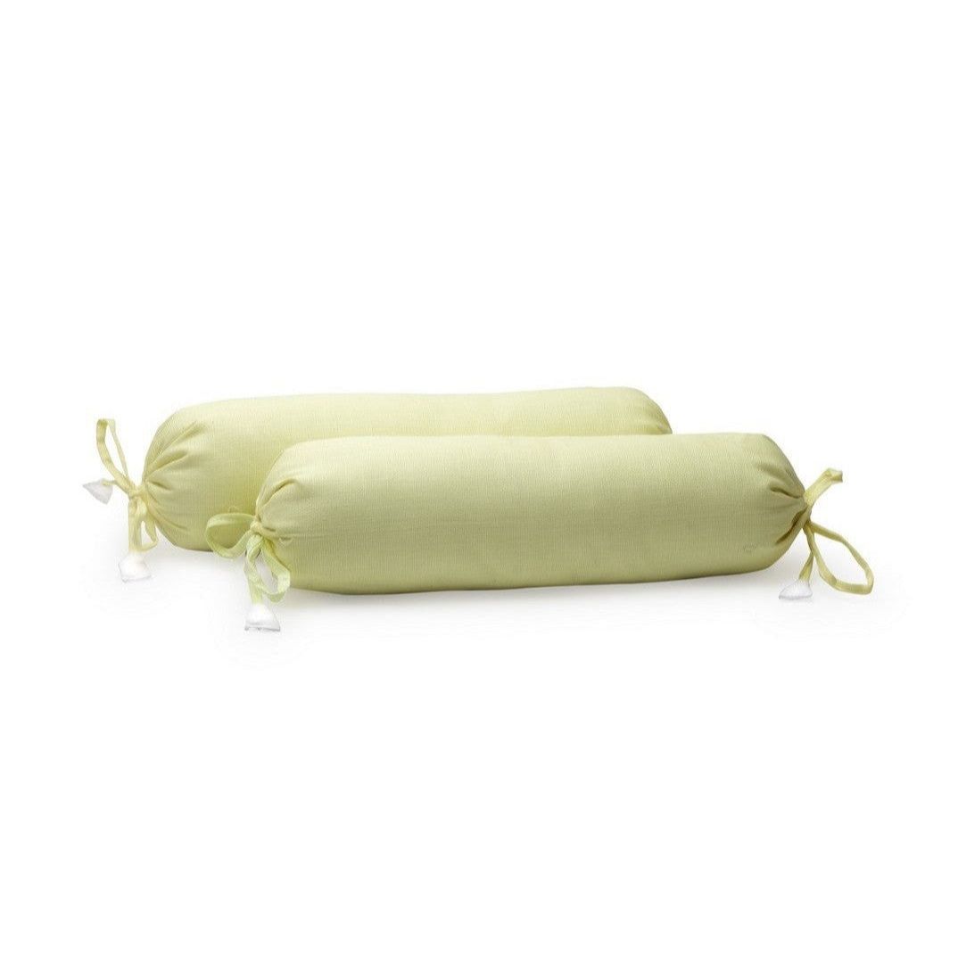A pair of lemon yellow organic cotton baby bolster covers with a drawstring closure.