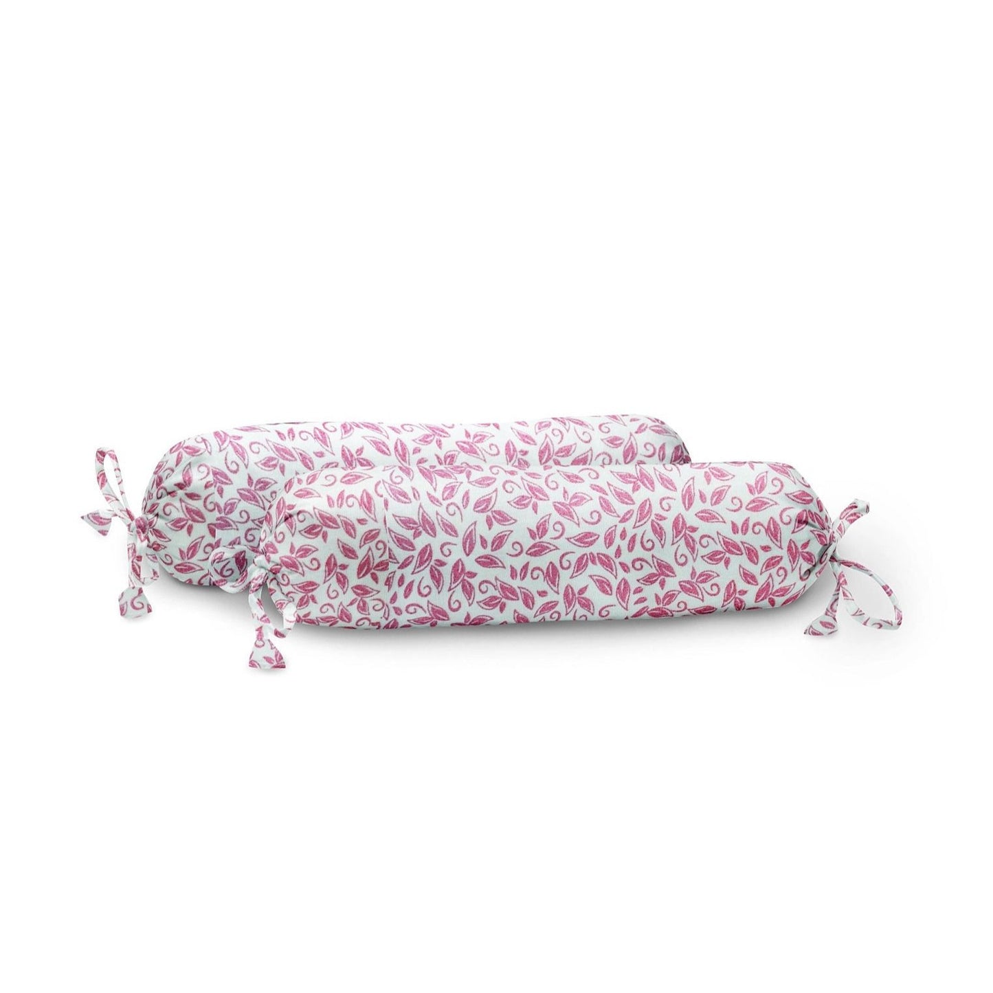A pink and white floral organic baby bolster cover with a tassel detail, placed on a white background.