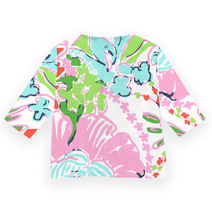 Colorful floral-patterned shirt on a white background